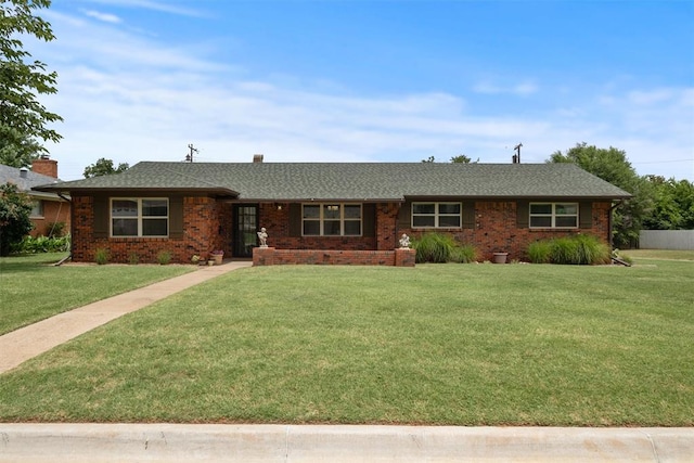 ranch-style house with a front lawn