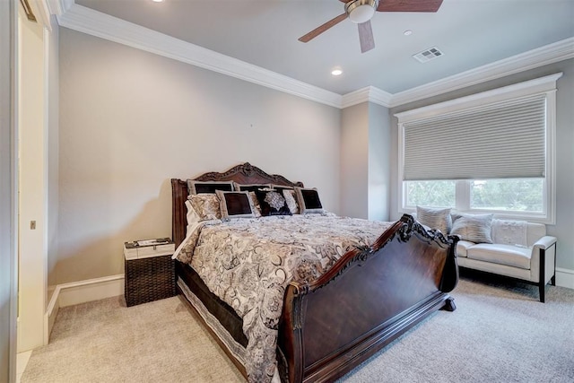 bedroom with ceiling fan, light carpet, and ornamental molding