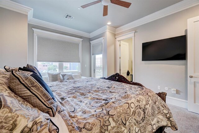 bedroom featuring ceiling fan, crown molding, and carpet floors