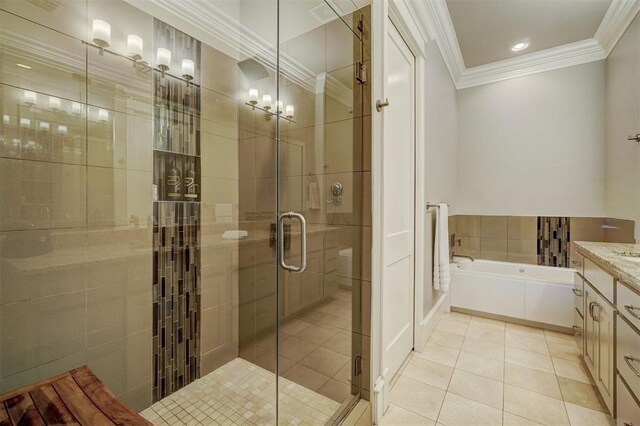 bathroom with tile patterned flooring, vanity, ornamental molding, and shower with separate bathtub