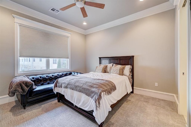 bedroom with ceiling fan, light colored carpet, and ornamental molding