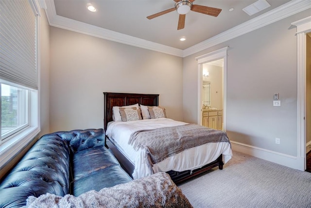 carpeted bedroom with ceiling fan, ensuite bathroom, and crown molding