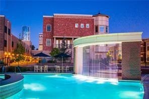 view of swimming pool featuring pool water feature