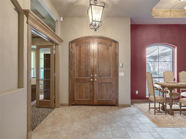 foyer featuring a notable chandelier