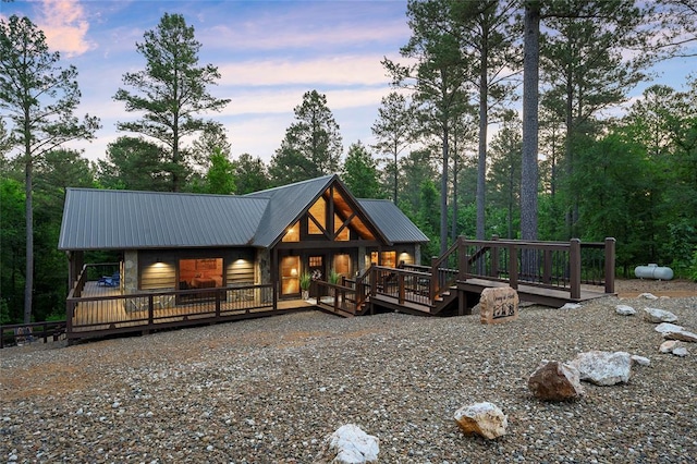 view of back house at dusk