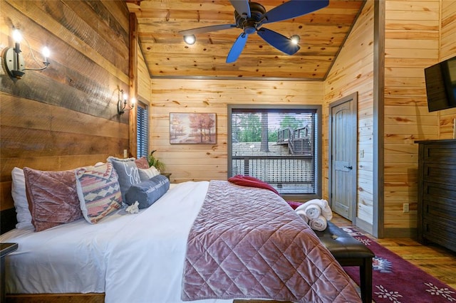 bedroom with wood ceiling, ceiling fan, wooden walls, wood-type flooring, and lofted ceiling