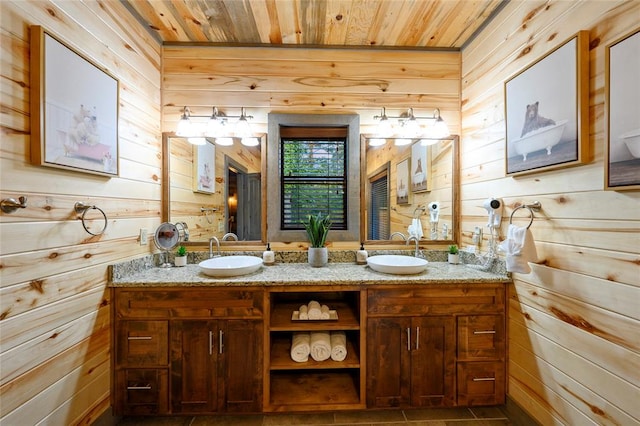 bathroom featuring wood walls, tile patterned flooring, vanity, and wood ceiling