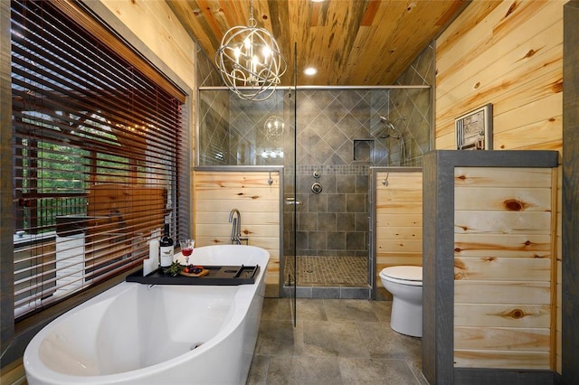 bathroom featuring wood walls, wooden ceiling, an inviting chandelier, toilet, and independent shower and bath