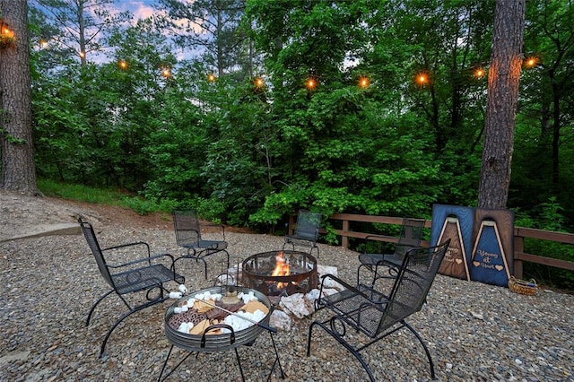 patio terrace at dusk with a fire pit