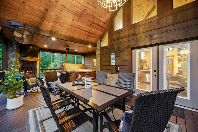 dining room featuring high vaulted ceiling, wood walls, wood-type flooring, and wood ceiling