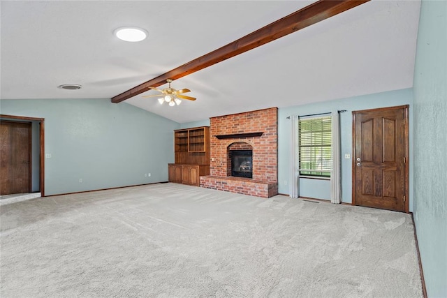 unfurnished living room featuring a fireplace, vaulted ceiling with beams, light colored carpet, and ceiling fan