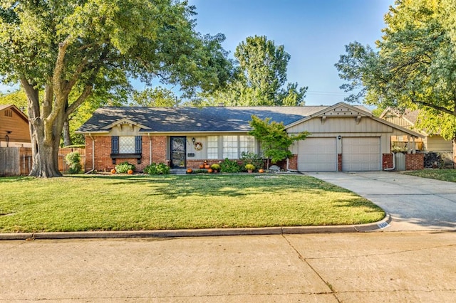 single story home featuring a garage and a front yard