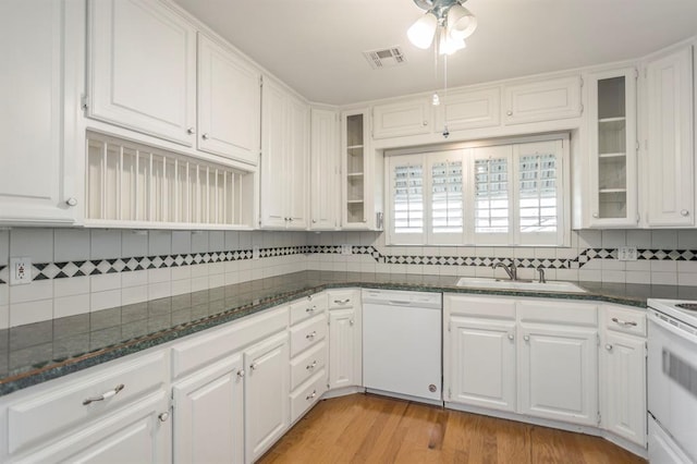 kitchen featuring white cabinetry, white appliances, sink, and light hardwood / wood-style flooring