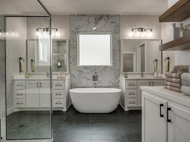 bathroom featuring vanity, tile patterned flooring, independent shower and bath, and tile walls