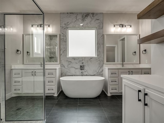 bathroom featuring vanity, tile patterned flooring, tile walls, and separate shower and tub