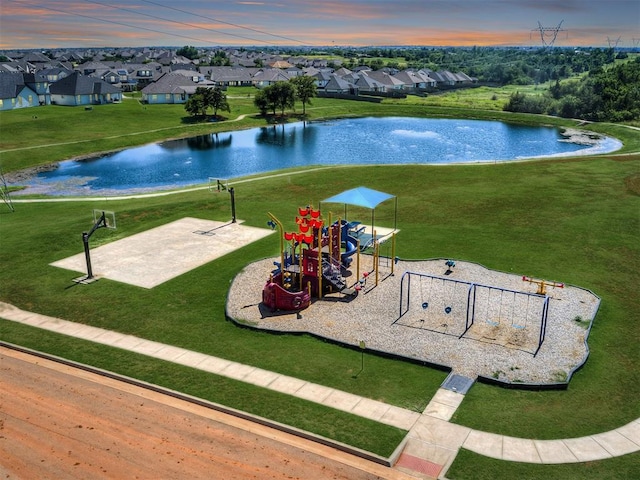 view of property's community featuring a playground and a water view