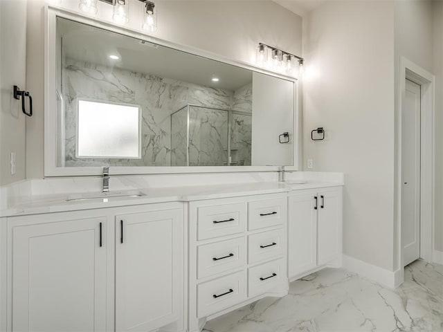 bathroom with vanity and a shower with door