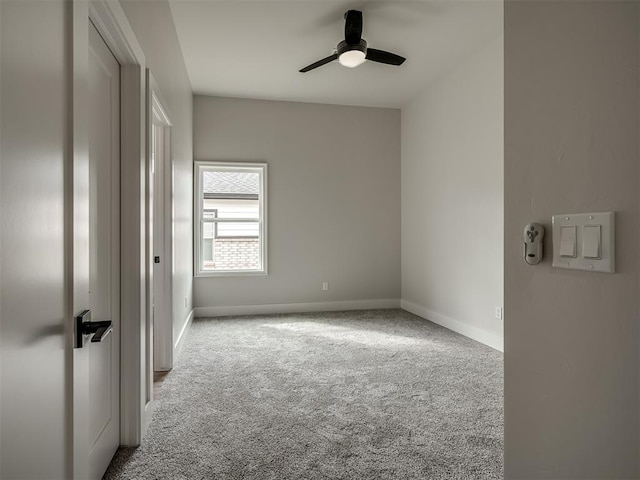 unfurnished room featuring light carpet and ceiling fan