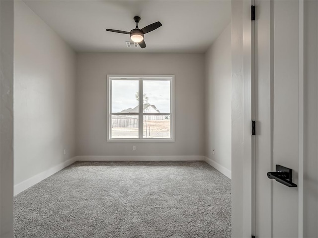 carpeted empty room with ceiling fan