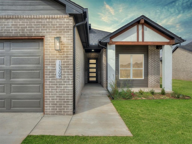 doorway to property featuring a yard