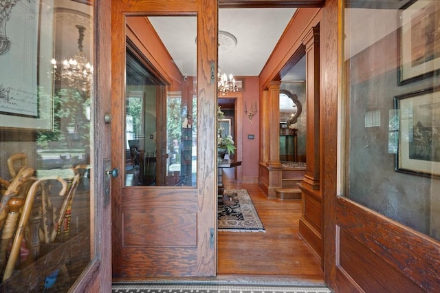 dining area featuring french doors, a notable chandelier, and hardwood / wood-style flooring