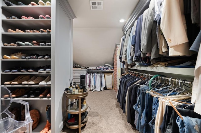 spacious closet featuring carpet flooring