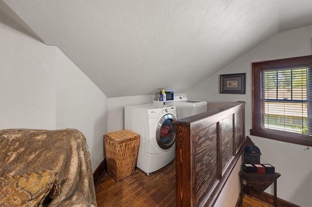 clothes washing area featuring separate washer and dryer and dark wood-type flooring