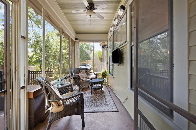 sunroom / solarium featuring ceiling fan and a wealth of natural light