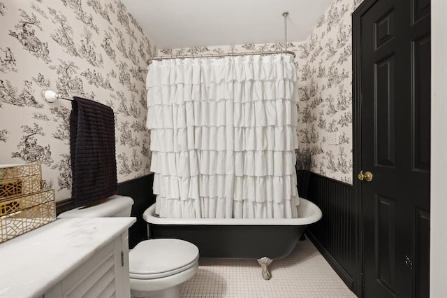 bathroom with tile patterned flooring and toilet