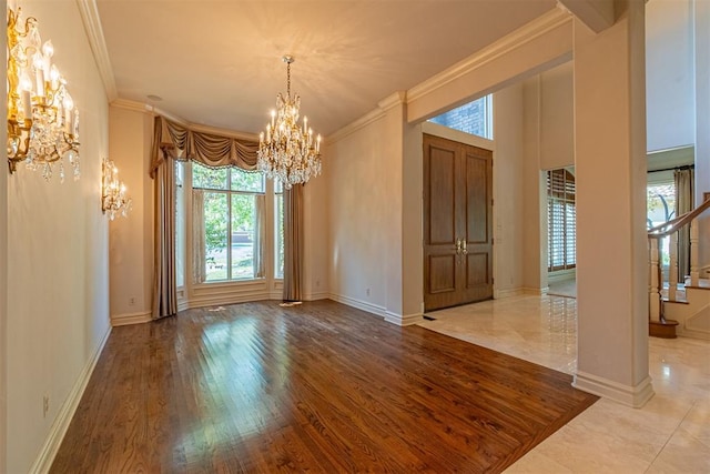 12308 Bywater Rd, Oklahoma City, OK 73170 - spare room featuring a chandelier, plenty of natural light, ornamental molding, wood finished floors, and stairs