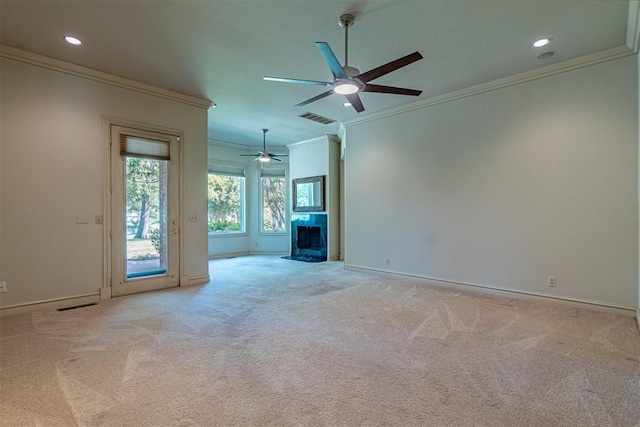 unfurnished living room featuring light colored carpet, ceiling fan, and crown molding