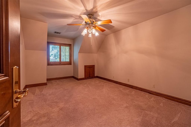 bonus room with light colored carpet, ceiling fan, and lofted ceiling