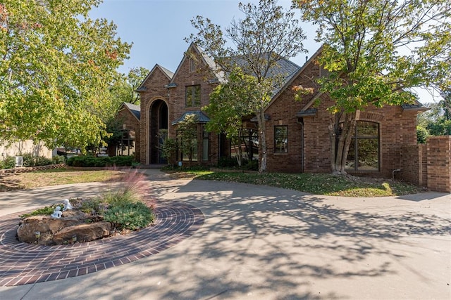 12308 Bywater Rd, Oklahoma City, OK 73170 - view of front of home with brick siding and curved driveway