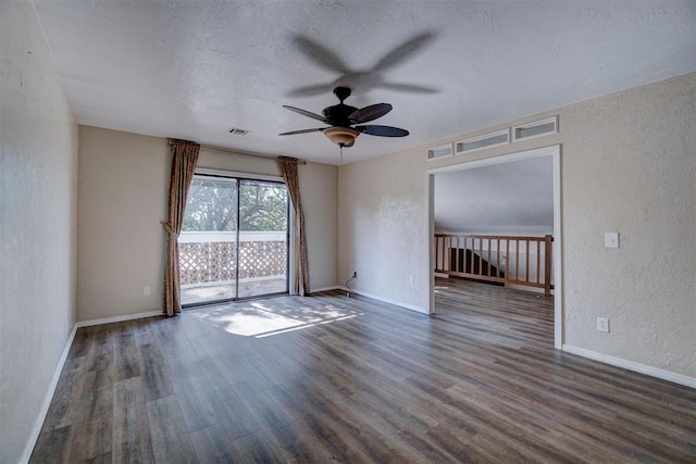 unfurnished room featuring dark hardwood / wood-style floors and ceiling fan