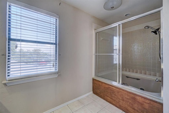 bathroom with tile patterned floors and enclosed tub / shower combo