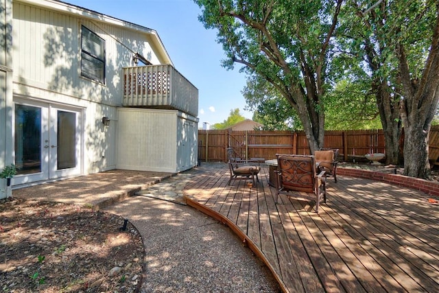 view of patio with french doors, a balcony, and a deck