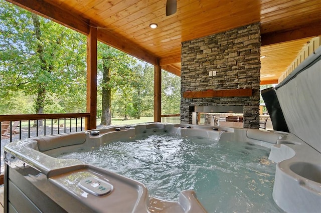 wooden deck with a hot tub