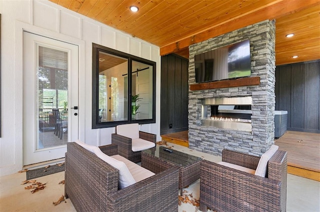 view of patio / terrace featuring an outdoor stone fireplace