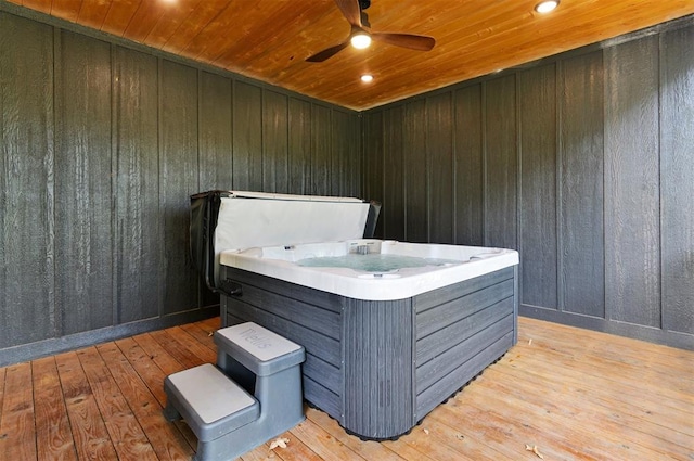 misc room featuring a jacuzzi, light hardwood / wood-style floors, ceiling fan, and wooden ceiling