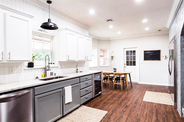 1405 Rosehaven Dr, Altus, OK 73521 - kitchen with dishwasher, gray cabinets, wine cooler, a brick fireplace, and decorative backsplash