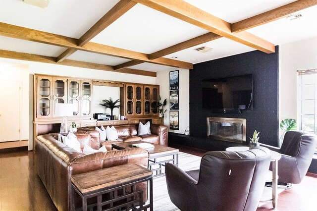 1405 Rosehaven Dr, Altus, OK 73521 - living area with coffered ceiling, beamed ceiling, wood finished floors, and a fireplace
