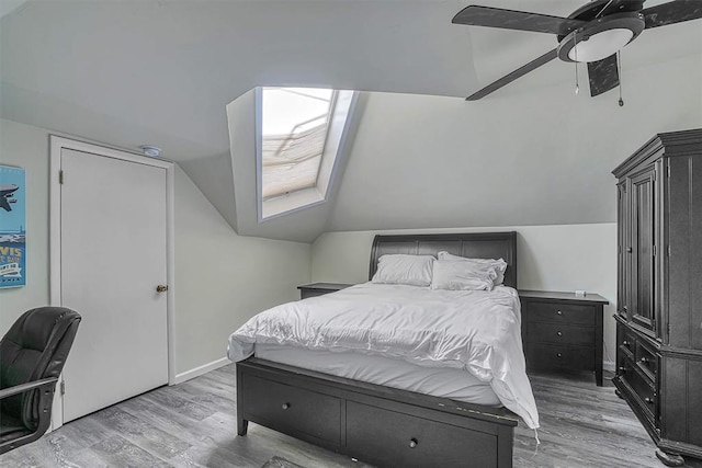1405 Rosehaven Dr, Altus, OK 73521 - bedroom with light wood-style floors, vaulted ceiling, and a ceiling fan