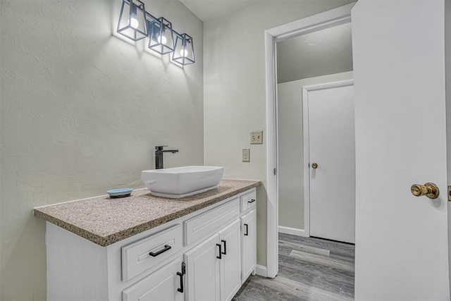 1405 Rosehaven Dr, Altus, OK 73521 - bathroom featuring wood finished floors and vanity