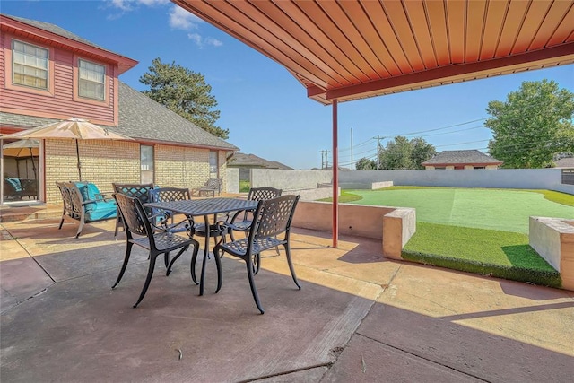1405 Rosehaven Dr, Altus, OK 73521 - fenced backyard with a patio and outdoor dining area