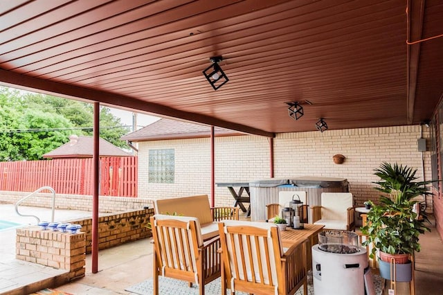 1405 Rosehaven Dr, Altus, OK 73521 - fenced backyard with a hot tub, a patio, and a fire pit