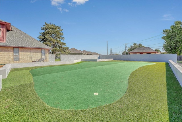 1405 Rosehaven Dr, Altus, OK 73521 - view of yard featuring a putting green