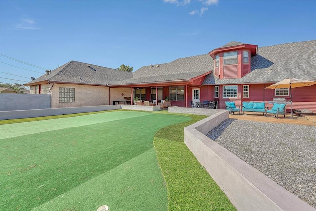 1405 Rosehaven Dr, Altus, OK 73521 - back of house featuring an outdoor living space, a patio, and a shingled roof