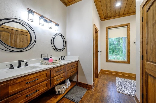 bathroom with ornamental molding, vanity, wood ceiling, and hardwood / wood-style flooring