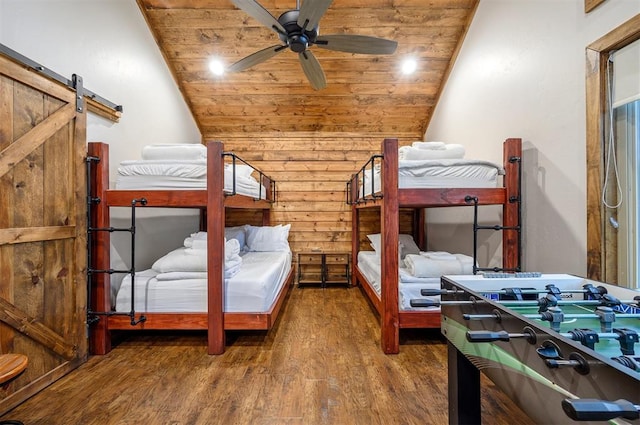 bedroom with ceiling fan, wood-type flooring, wood ceiling, and vaulted ceiling