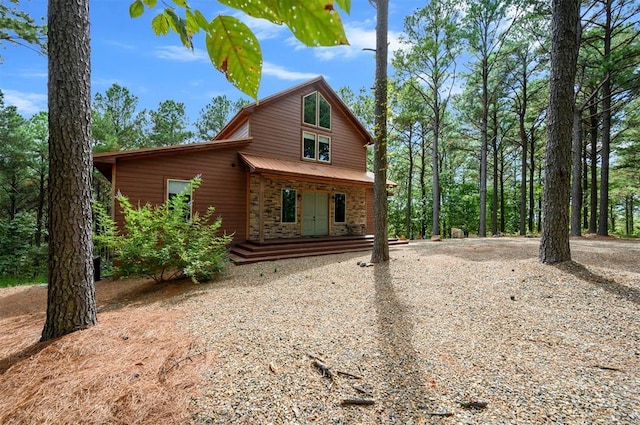 view of front facade with a porch and french doors